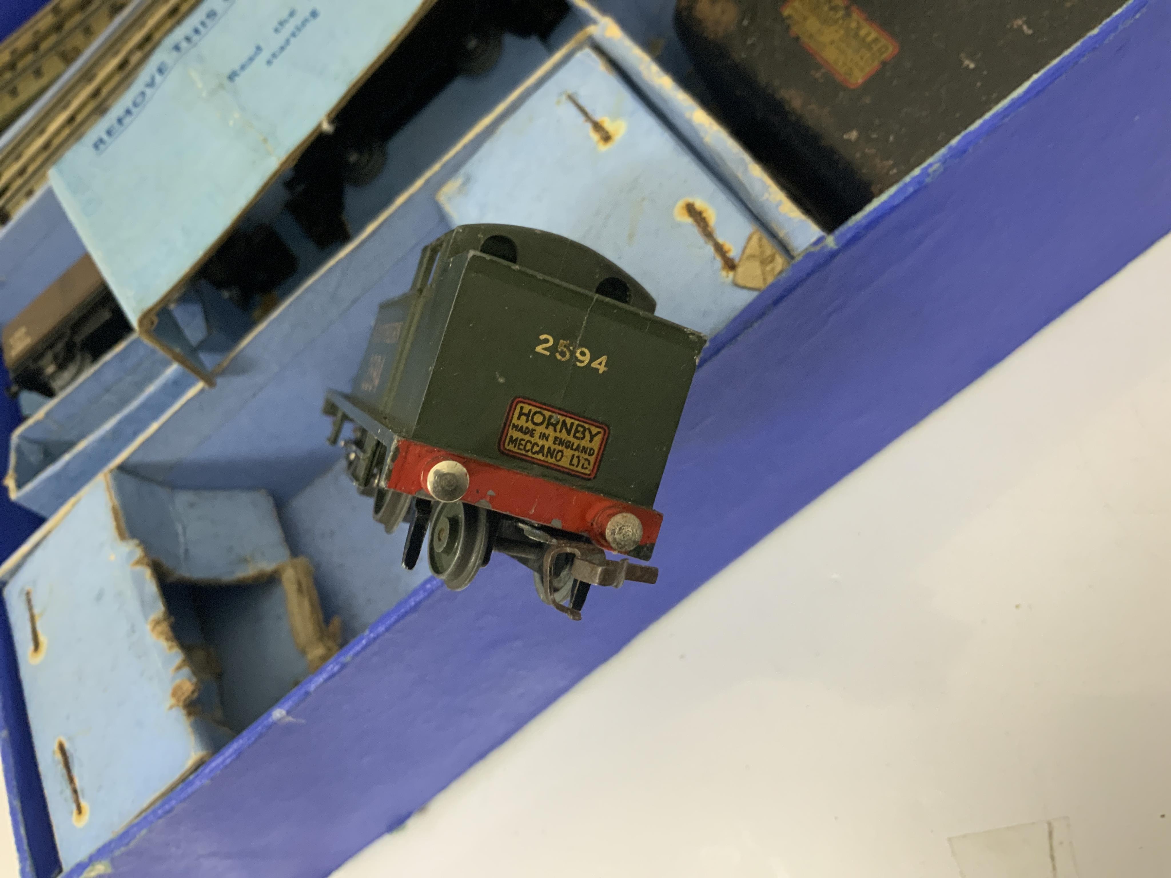 A boxed Hornby Dublo EDG7 Southern Railway Tank Goods Set, comprising of an SR Class N2 0-6-2T locomotive, 2594, for 3-rail running, two Southern freight wagons and an associated LMS open wagon, track sections, etc.